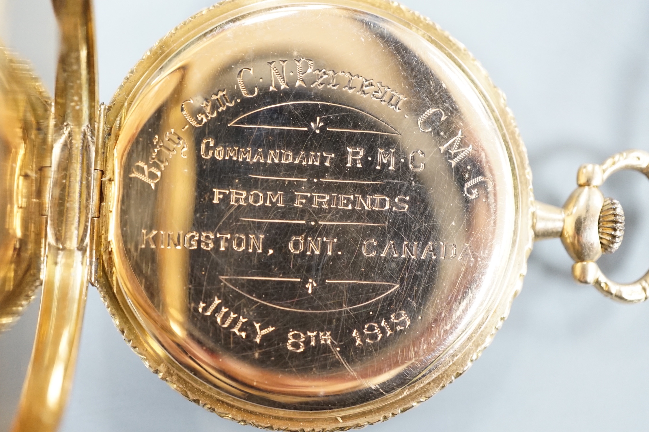 An early 20th century Swiss yellow metal open faced keyless dress pocket watch, retailed by Kinnear & D'Esterre, case diameter 44mm, gross 52 grams.